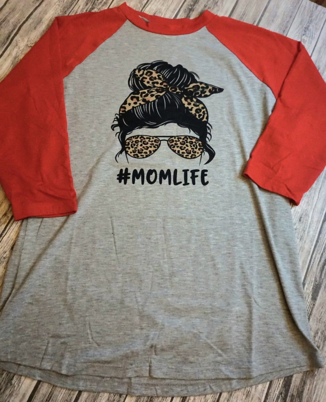 mom life raglan, red sleeves, light grey body, 3/4 inch sleeves, messy bun with leopard bandana and sunglasses, black hair